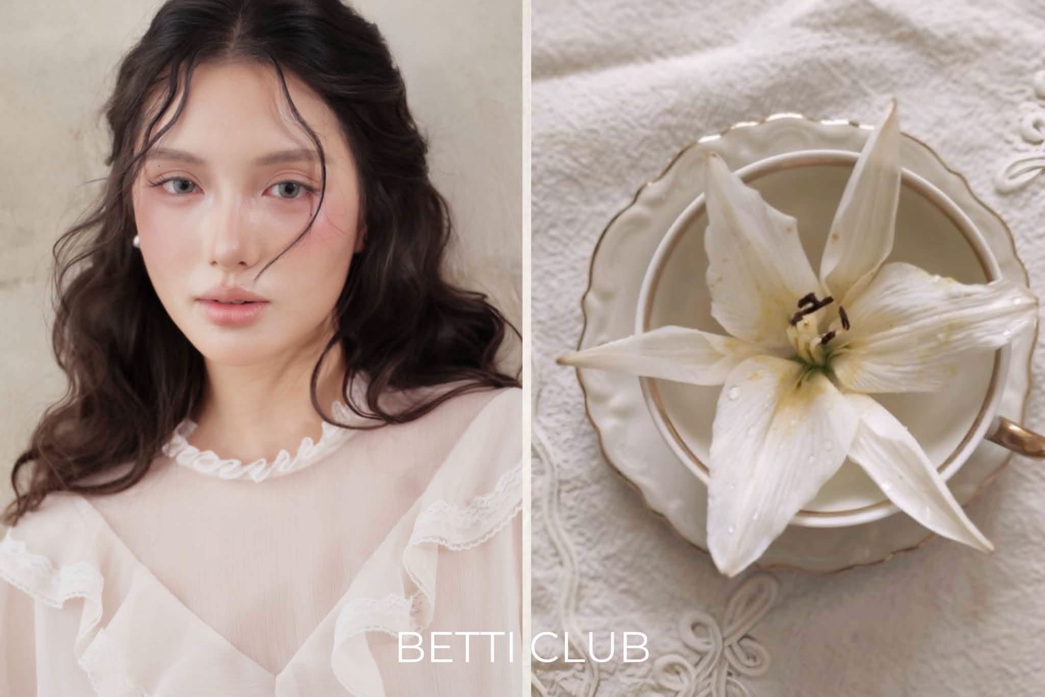 Betti Club — cô gái trong thiết kế trắng bên hoa lily